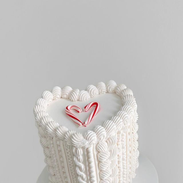 a heart shaped cake on top of a white plate