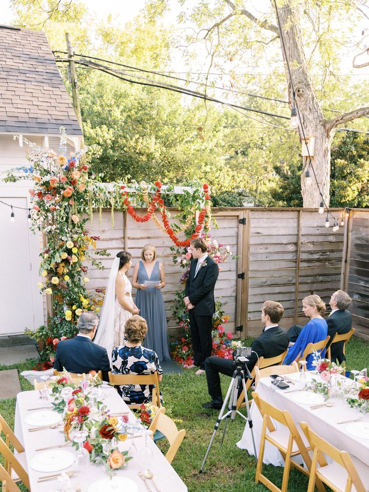 a couple getting married at their backyard wedding