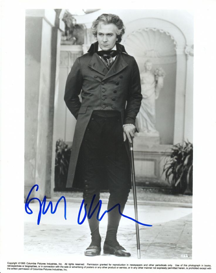 an autographed photograph of a man with a cane