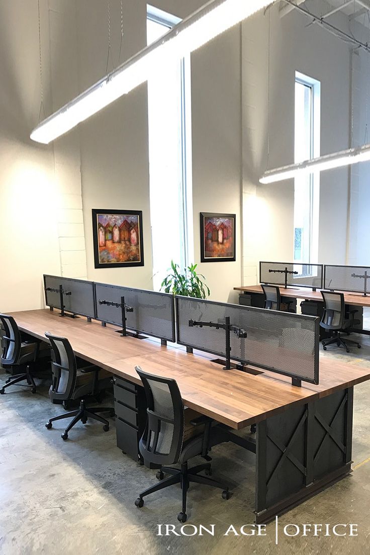 an empty office with desks and chairs