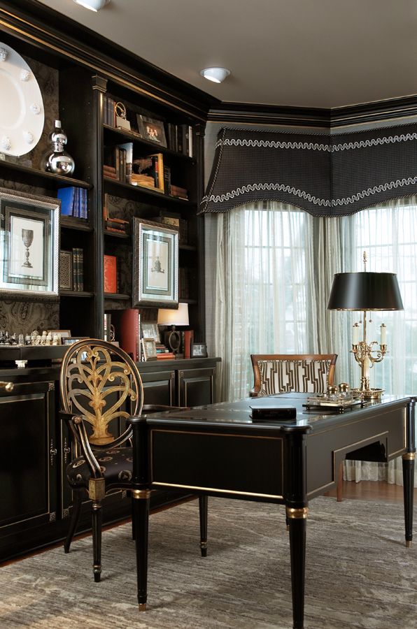 a living room filled with lots of furniture and bookshelves next to a window