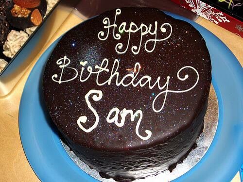 a birthday cake with the words happy birthday son on it sitting on a blue plate