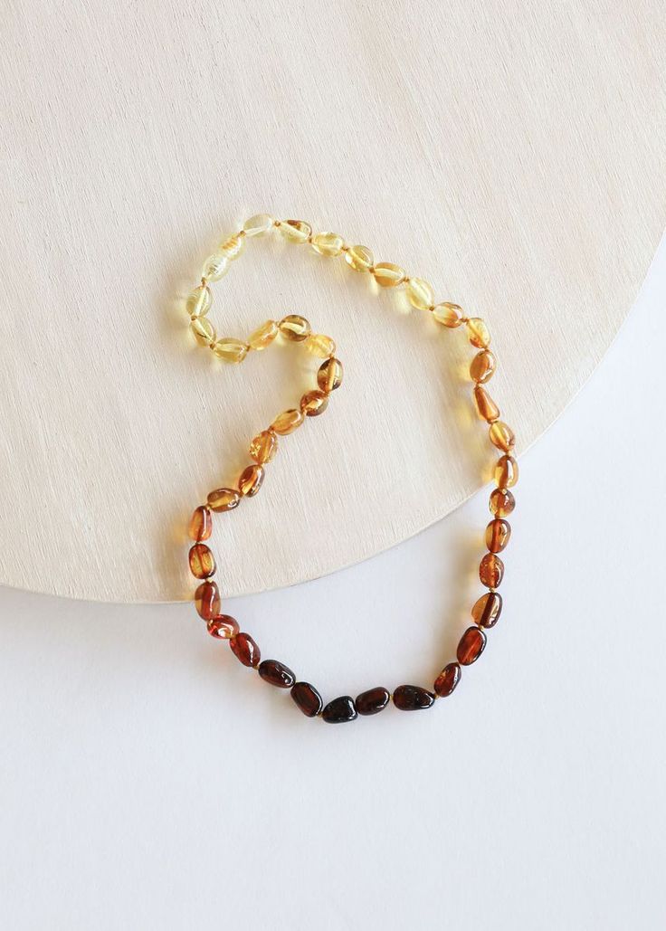 Luxury Amber Beaded Necklaces With Natural Stones, Cheap Amber Necklaces For Gifts, Cheap Amber Beaded Necklaces With Polished Beads, Luxury Amber Beaded Necklaces With Oval Beads, Affordable Amber Beaded Jewelry, Luxury Amber Oval Beaded Necklace, Luxury Baltic Amber Necklace In Amber Color, White Amber Necklace, Luxury Gold Baltic Amber Necklace