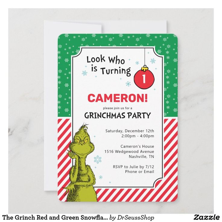 the grinch birthday party is set up on a white marble table with green and red stripes