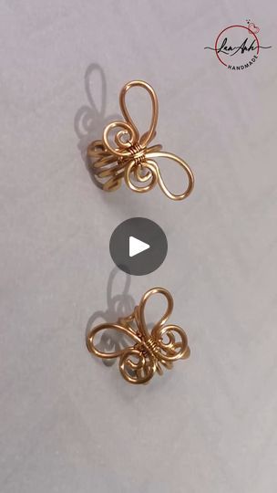 the video shows how to make an origami butterfly brooch with gold wire