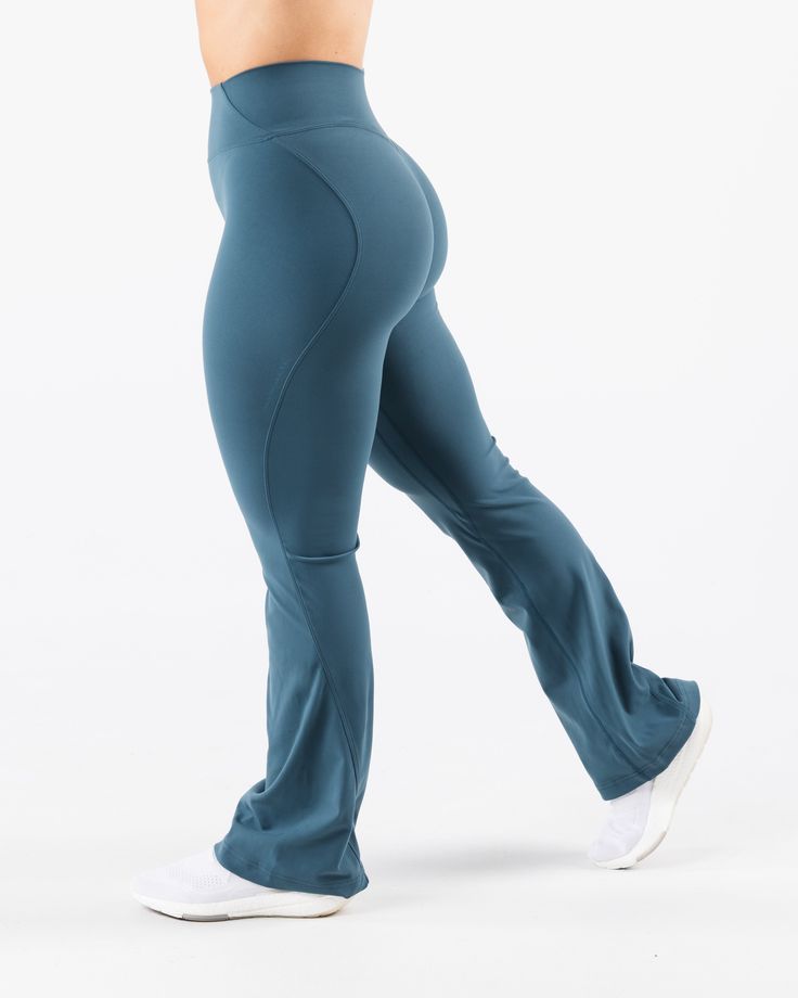 HIGHLIGHTS. Sculpting seamlines Buttery soft hand feel High Stretch Flared leg Sizes XXS - M: 31" inseam Sizes L - XXL: 32.5" inseam FIT SUGGESTION. This item runs true to Alphalete's standard sizing.. We recommend sizing up for a more relaxed fit or down for a more compressive fit.. Model is 5’2”/157.5cm, wearing a size. S. with 39"/99cm hips and 28”/71.1cm waist. MATERIALS AND WASHING DIRECTIONS. 75%. Nylon,. 25%. Spandex. We recommend washing inside-out on a cold setting. Hang to dry DESCRIPT High Stretch Mid-rise Workout Pants, Sporty Flared Bottoms For Loungewear, High Waist Sports Bottoms With Loosely Fitted Hips, Fitted Flare Bottoms For Loungewear, High Stretch Workout Bottoms, High Stretch Flare Loungewear Bottoms, High Stretch Flare Bottoms For Loungewear, Flare High Stretch Loungewear Bottoms, High-cut Leg Bottoms With 4-way Stretch For Workout