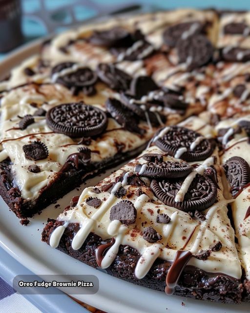 a chocolate cake with oreo cookies and cream on it