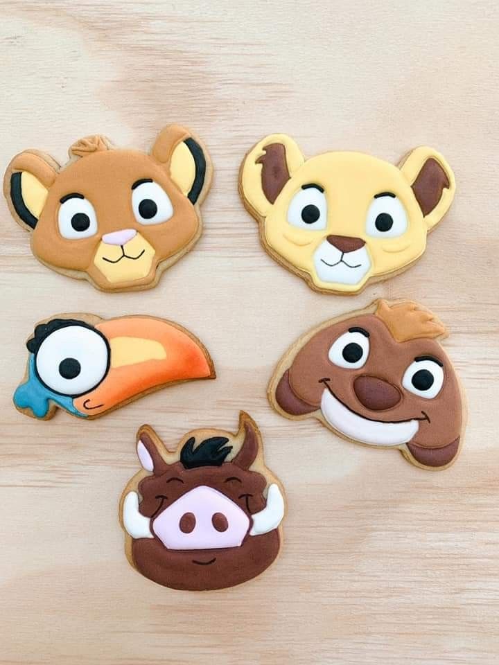 some kind of animal face cookies on a table