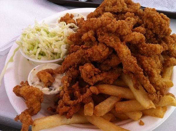 fried chicken and french fries on a plate with coleslaw