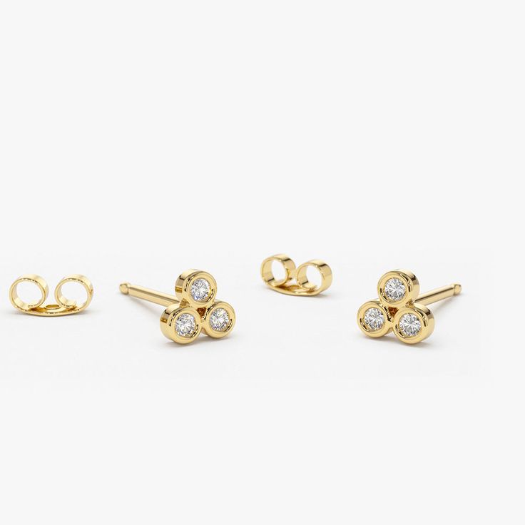 Made to Order
Gold KT: 14K
Round Diamond: 6 pcs 2.0MM
Total CTW: 0.18ctw
Diamond Color-Clarity: G Color Si Clarity
Setting Type: Bezel

Each dainty gold earring features three striking round cut bezel-set diamonds.  Treat a special woman in your life to gorgeous gold diamond trio stud earrings she can wear from sun up to sundown. Custom Diamond Jewelry, Dainty Gold Earrings, Types Of Diamonds, Bezel Set Diamond, Gold Earring, Bezel Diamond, Diamond Color, Creative Arts, Elegant Earrings