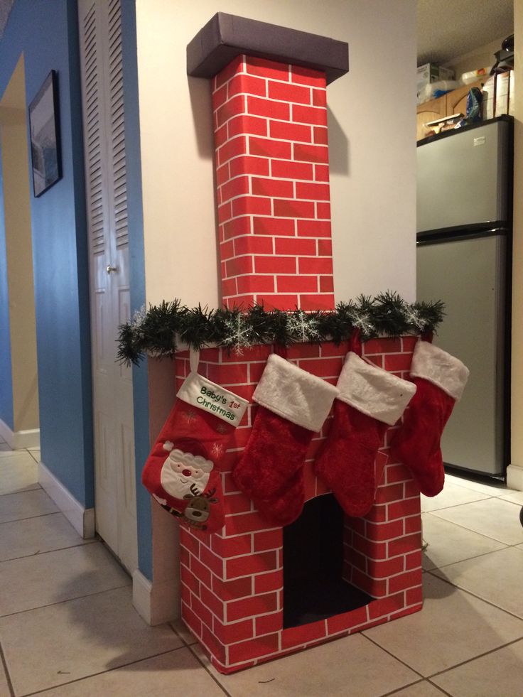 a red brick fireplace with stockings and stockings hanging from the top, decorated for christmas