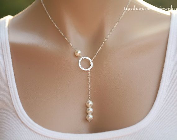 An elegant karma circle necklace with a pearl string pendant 1. a 8mm Swarovski white/ivory pearl above 2. a sterling silver karma circle (smooth or hammered surface) 3. a string of three Swarovski pearls at the end of the dangled chain 4. a sterling silver chain with a lobster Easy Jewelry Making Ideas Simple, Lariat Necklace With Round Beads As Gift, White Lariat Necklace With Round Beads As Gift, Round Beads Single Strand Lariat Necklace As Gift, White Single Strand Lariat Necklace For Gift, Elegant Personalized Jewelry With Round Beads, Elegant Personalized Round Bead Jewelry, White Pearl Charm Lariat Necklace Gift, White Lariat Necklace With Pearl Charm As Gift