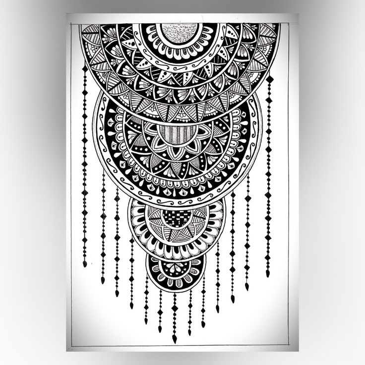 a black and white drawing of an intricate design on a sheet of paper with beads hanging from it's sides