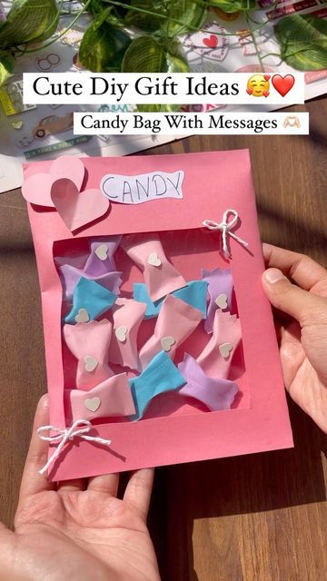 someone holding up a candy bag with pink and blue bows on it that says, cute diy gift ideas candy bag with messages