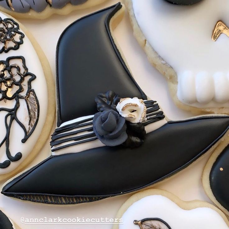 decorated cookies with black and white designs on them