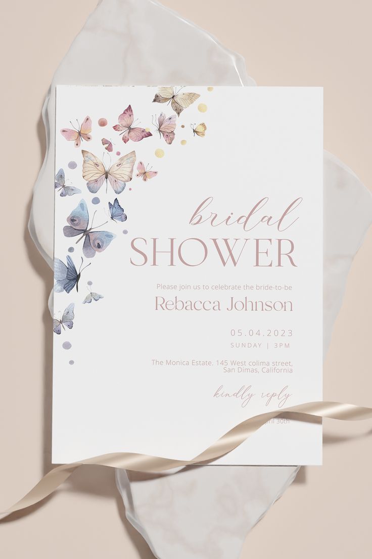 a white and pink bridal shower card with butterflies on it