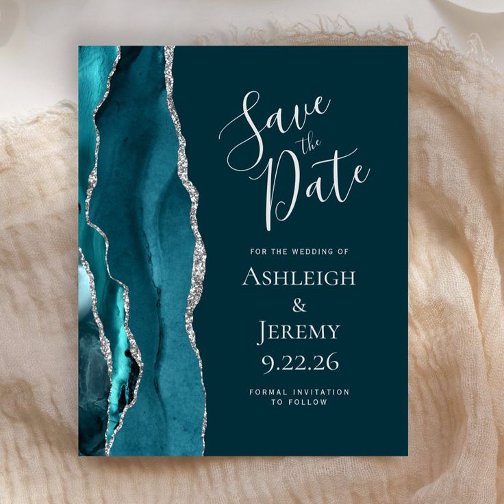 save the date card with teal and silver foil