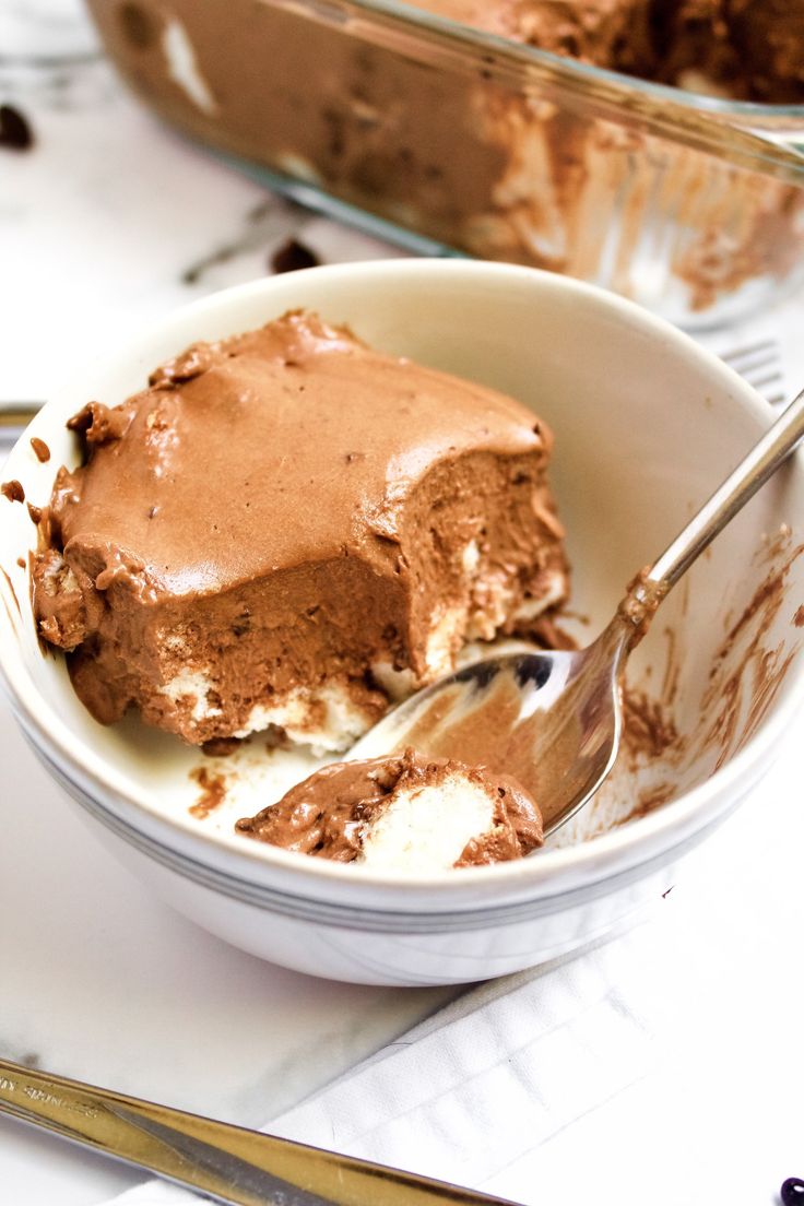 a bowl filled with ice cream and chocolate cake