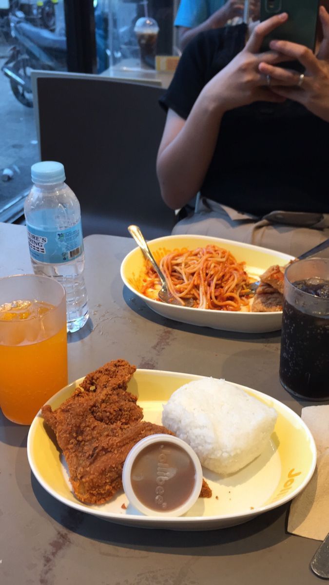 two plates of food are sitting on a table