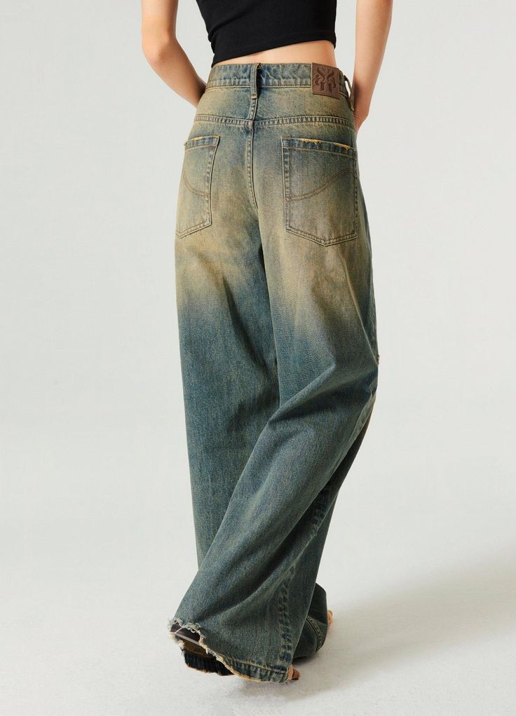 Retro-Inspired Wide Leg Denim Jeans - Embrace a nostalgic look with these wide and baggy fit jeans. Featuring a straight leg design, ripped back hemline, and distressing details, these 100% denim cotton jeans are unisex and perfect for any casual outfit. Available in wash blue, they include a unique SP leather patch on the back. Sizes: Extra Small, Small, Medium, Large, Extra Large SIZE (CM) LENGTH WAIST BUTT EXTRA SMALL 101 69 90 SMALL 104 75 96 MEDIUM 106 79 100 LARGE 108 83 104 EXTRA LARGE 11 Faded Oversized Straight Leg Bottoms, Oversized Straight Leg Faded Bottoms, Distressed Wide Leg Relaxed Fit Flare Jeans, Distressed Wide Leg Flare Jeans With Relaxed Fit, Faded Oversized Straight Leg Jeans, Baggy Wide Leg Cargo Jeans In Faded Color, Distressed Wide Leg Jeans In Relaxed Fit, Baggy Faded Wide Leg Cargo Jeans, Faded Baggy Wide Leg Cargo Jeans