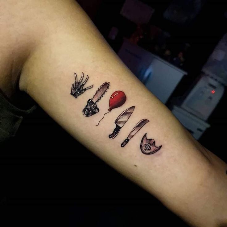 a tattoo with different types of knives on the arm