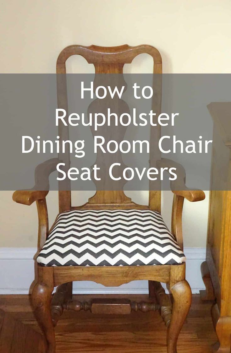 a wooden rocking chair with black and white striped seat covers on it, in the corner of a room