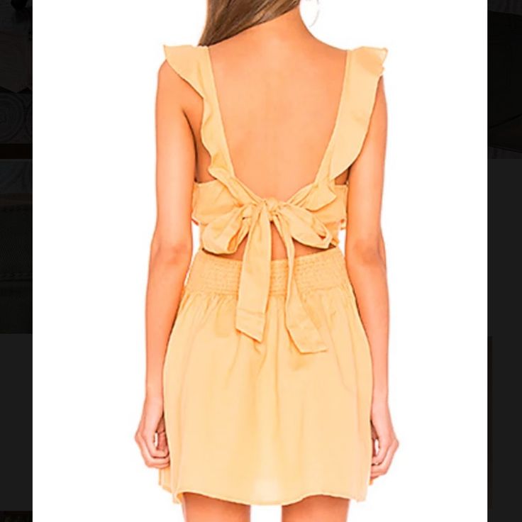 Brand New With Tags. Size Small. Free People Mini Dress With Ruffles And A Tie In The Back. Color Is Called “Sun Yellow” But Is More Of An Orange. Perfect Condition. (Bin 1) Yellow Tie-back Dress For Vacation, Yellow Backless Summer Dress, Yellow Backless Mini Dress For Vacation, Yellow Mini Dress For Casual Wear, Casual Backless Sundress With Ruffles, Casual Backless Ruffled Sundress, Yellow Tie Back Mini Dress For Beach, Yellow Mini Dress With Tie Back For Brunch, Yellow Mini Sundress With Ruffles