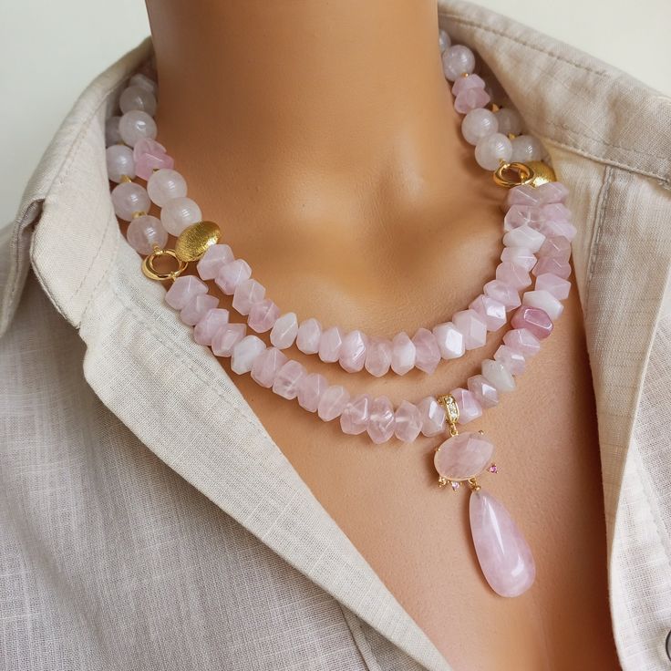 Enhance your boho style with this stunning Pink Quartz Necklace. This stunning natural stone beaded necklace features a pendant made of beautiful pink quartz gemstone that radiates positive energy and feminine elegance. Perfect for everyday wear or special occasions, this unique quartz jewelry makes a thoughtful gift for women who appreciate natural beauty and elegant appeal. MATERIALS: Pink Quartz gemstones: These genuine gemstones, extracted from the depths of the earth, add depth and mystery Handmade Rose Quartz Beaded Necklace With Round Beads, Bohemian Pink Crystal Necklaces With Faceted Beads, Bohemian Pink Crystal Necklace With Faceted Beads, Pink Bohemian Crystal Necklace With Faceted Beads, Bohemian Pink Crystal Necklace With Gemstone Beads, Pink Bohemian Crystal Necklace With Gemstone Beads, Bohemian Pink Pendant Crystal Necklace, Bohemian Pink Crystal Pendant Necklace, Bohemian Rose Quartz Jewelry With Gemstone Beads