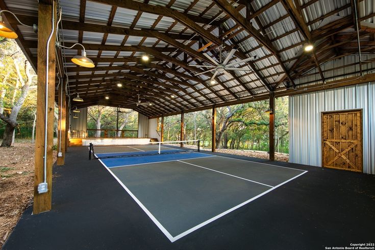 an indoor tennis court is shown in this image