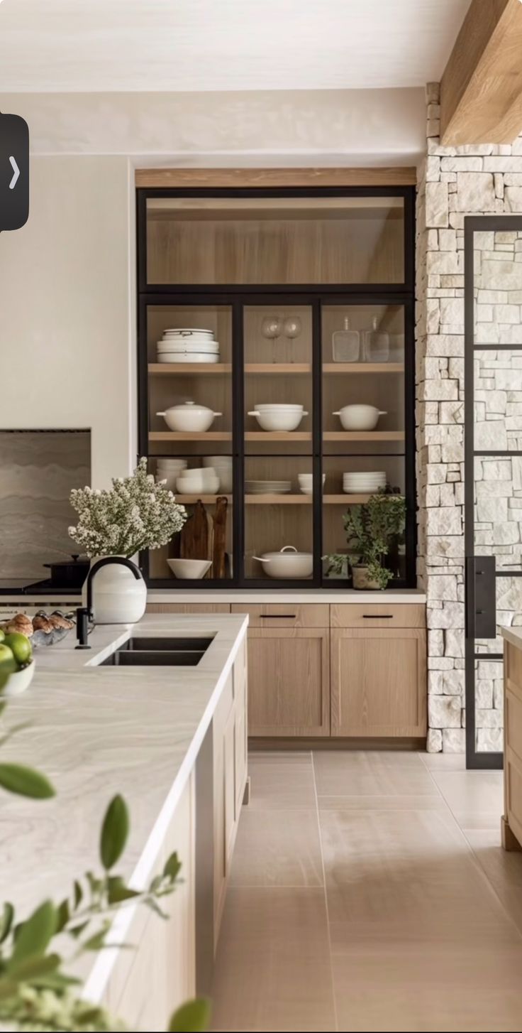 the kitchen is clean and ready to be used for cooking or baking, while also being used as a dining area