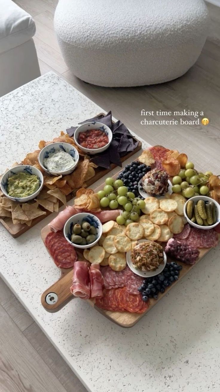 two trays filled with different types of food on top of a table next to each other