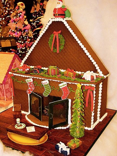 a gingerbread house decorated with christmas decorations