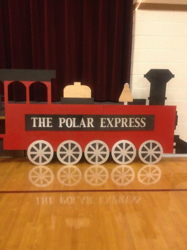 the polar express train is made out of wood and plastic, with wheels on each side