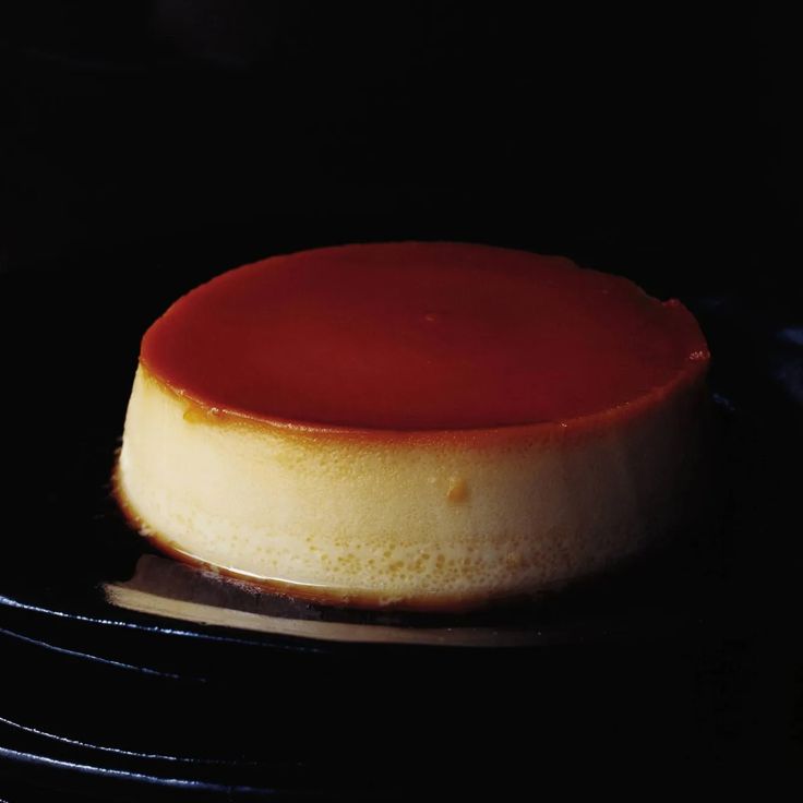 a cake sitting on top of a black plate