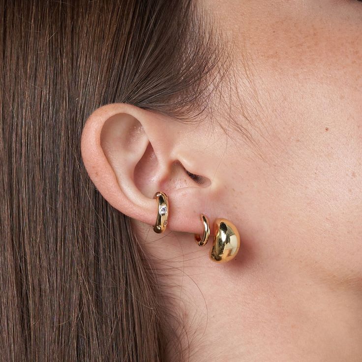 Safety PolicyCare InstructionsElevate your style with our Small Classic Huggie in exquisite gold vermeil. Delicately crafted, these earrings offer a touch of luxury, perfect for adding a radiant and refined accent to your everyday look.Gold Vermeil: Gold vermeil provides that lux look you love at a great price. This piece has a thick layer of 18K gold (up to 5 times more than regular plating) over 925 sterling silver. Gold Plated Ear Cuff, Gold Earrings With Shiny Finish In Fine Jewelry Style, Gold Earrings With Shiny Finish, Gold Plated Huggie Ear Cuff, Gold Plated Ear Cuff For Everyday Wear, Classic Gold-tone Huggie Earrings, Everyday Gold Plated Ear Cuff, Gold Plated Ear Cuff For Formal Occasions, Modern Gold Drop Cartilage Earrings