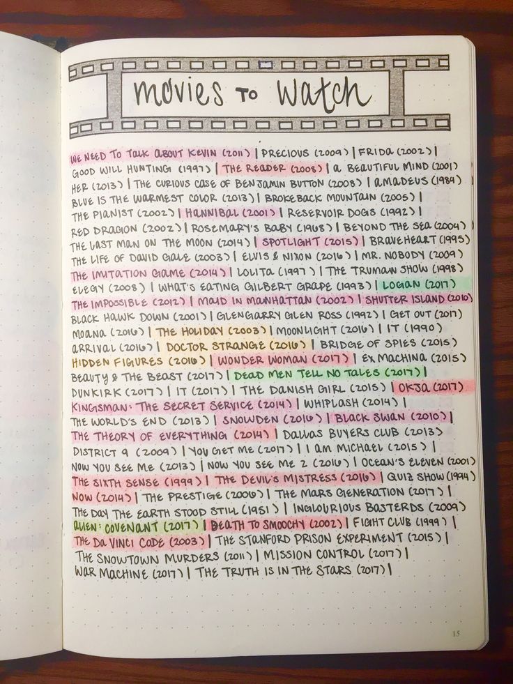 an open notebook with the words movies to watch written in rainbow - colored writing on it