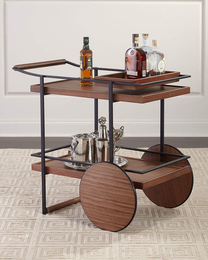 a wooden and metal serving cart with drinks on it