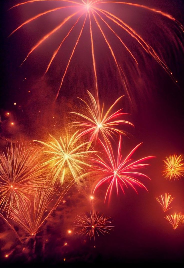 fireworks are lit up in the night sky with red, yellow and green colors on them