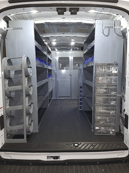 the interior of a white van with its doors open and shelves in place for various items to be stored