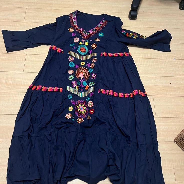 Never Worn Boho Tunic Dress With Floral Pattern. Blue Cotton Dress With Embroidered Hem, Traditional Blue Dress With Geometric Embroidery, Blue Bohemian Dress With Geometric Embroidery, Bohemian Blue Dresses With Geometric Embroidery, Casual Embroidered Dress With Hem Detail For Festivals, Blue V-neck Dress With Embroidered Hem, Blue Cotton Embroidered Beach Dress, Blue Floral Embroidered Beach Dress, Blue Cotton Embroidered Dress For Beach