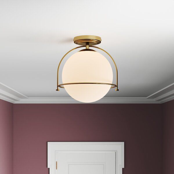 a room with a door and a light fixture on the ceiling above it is a white door