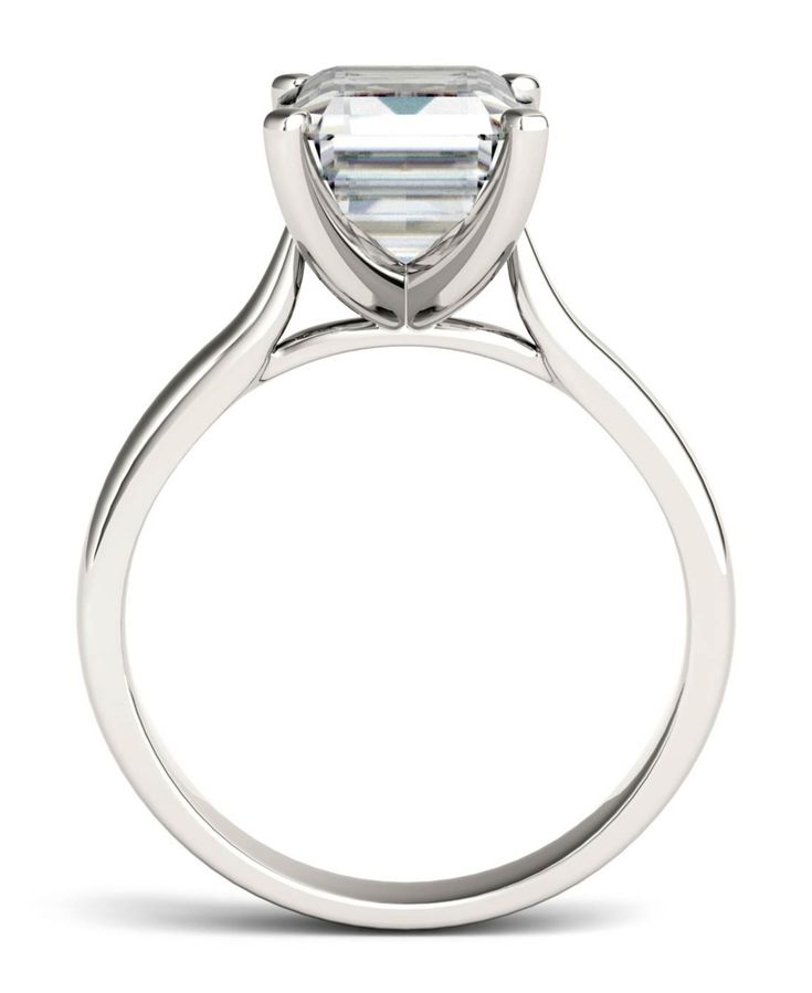 Fill her heart with love and delight with this romantic Moissanite by Charles & Colvard solitaire ring. A spectacular sight in glistening 14K white gold, this remarkable ring boasts a gorgeous 10X8mm emerald cut solitaire stone that sparkles beautifully. This extraordinary ring is sure to sweep her off of her feet. White Gold Baguette Cut Diamond Ring Vs Clarity, Platinum Diamond Ring With Vs Clarity Baguette Cut, Gia Certified Radiant Cut Ring For Formal Occasions, Gia Certified Radiant Cut Ring For Formal Events, Vs Clarity Baguette-cut Platinum Diamond Ring, Vs Clarity Baguette Cut Diamond Ring In Platinum, Platinum Baguette Cut Diamond Ring Vs Clarity, Vs Clarity Baguette Cut Platinum Diamond Ring, Gia Certified Baguette Cut White Gold Diamond Ring