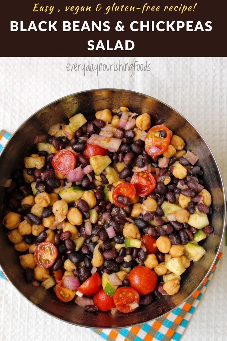 black beans and chickpeas salad in a metal bowl on top of a checkered cloth