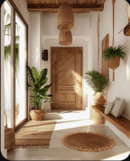 a hallway with plants and potted plants on the wall