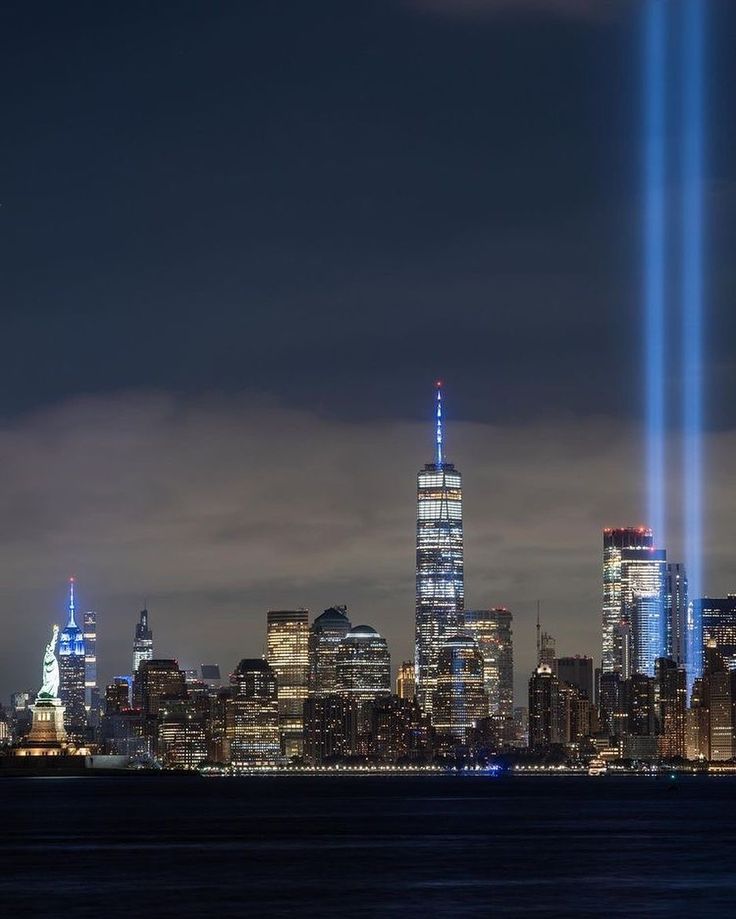 two beams of light illuminate the skyline of new york city