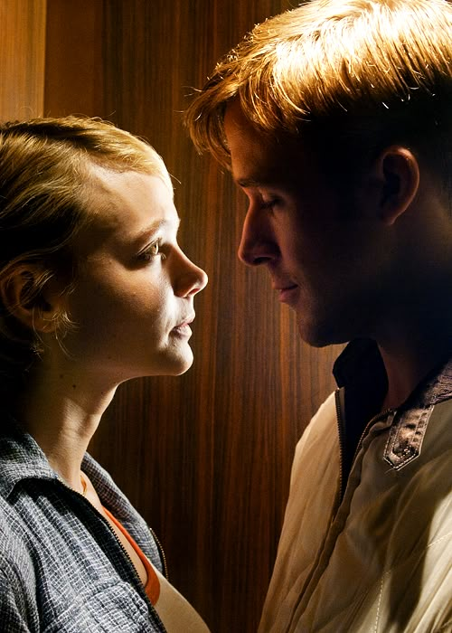 black and white photograph of a young man and woman looking into each other's eyes