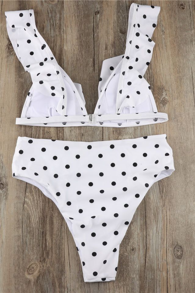 Featuresï�¼?/strong>Our charming Polka Dot High Waist Ruffle Bikini features a classy frill detail on the neckline rounding all the way to the back making this a drop-dead gorgeous design that's perfect for both thrilling island getaways and lazy suntan sessions. Featuring a metal clasp at the back. sewn-in pads and a playful polka dot print. this bikini adds a pop of vintage style that will give you a fun and feminine feel to your swimwear collection.Material: Nylon / SpandexPattern Type: DotSup Chic Polka Dot Swimwear For Beach, Chic Polka Dot Swimwear For Spring, Drop Dead, Sun Tan, Swimwear Collection, Polka Dot Print, Gorgeous Design, Dot Print, Vintage Style