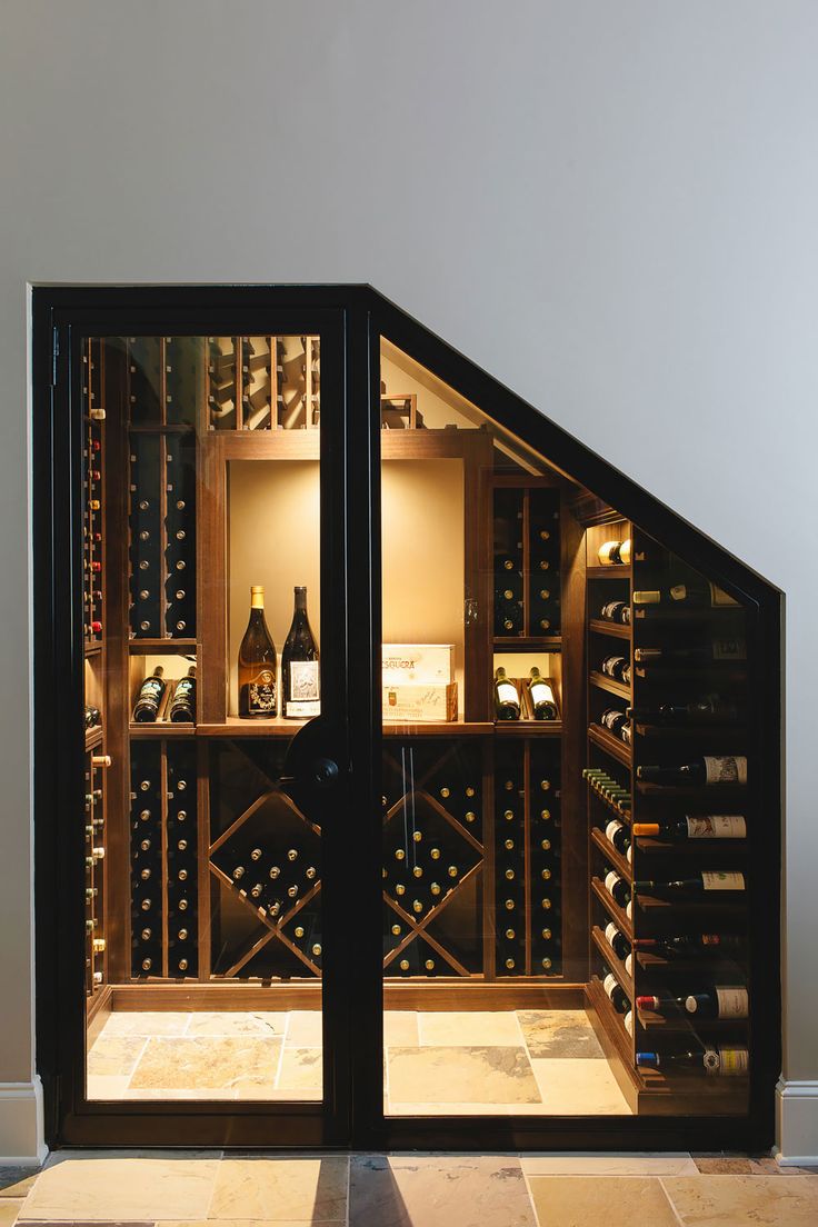 an open wine cellar with many bottles in it