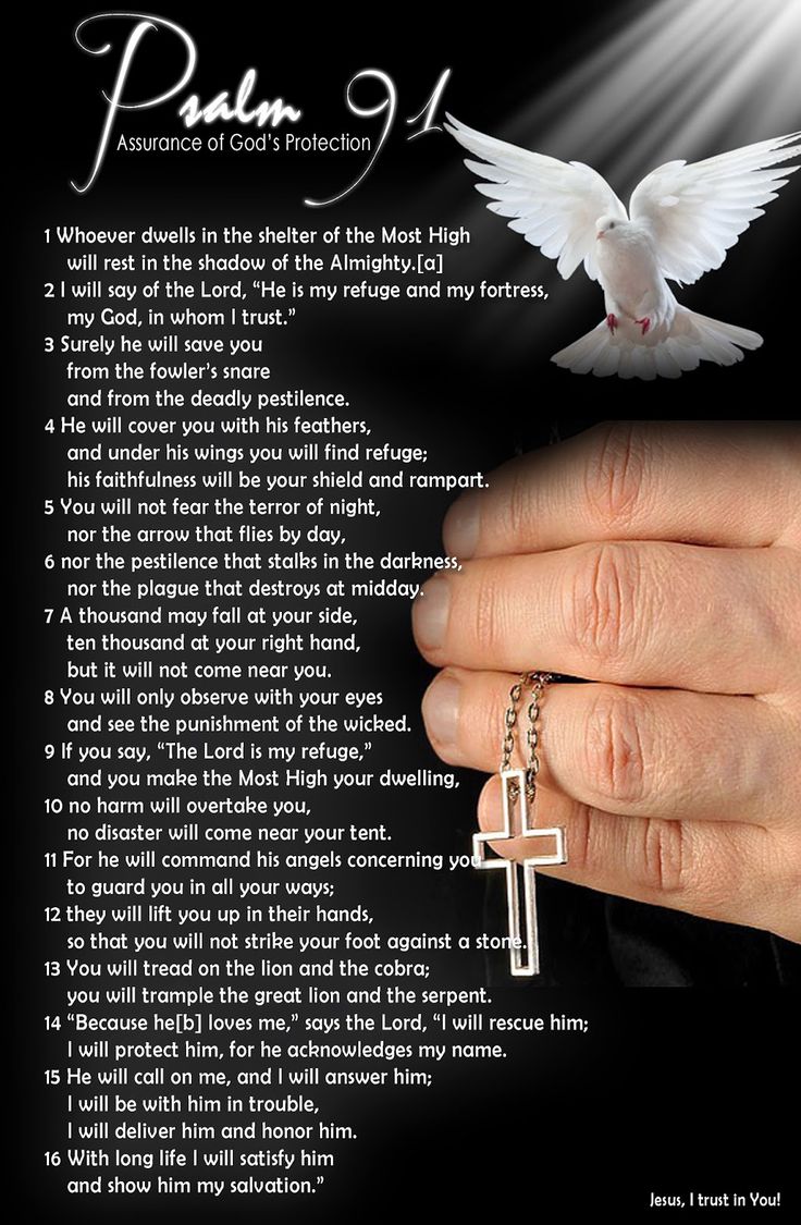 a person's hand holding a cross with the words pray on it and an image of a dove