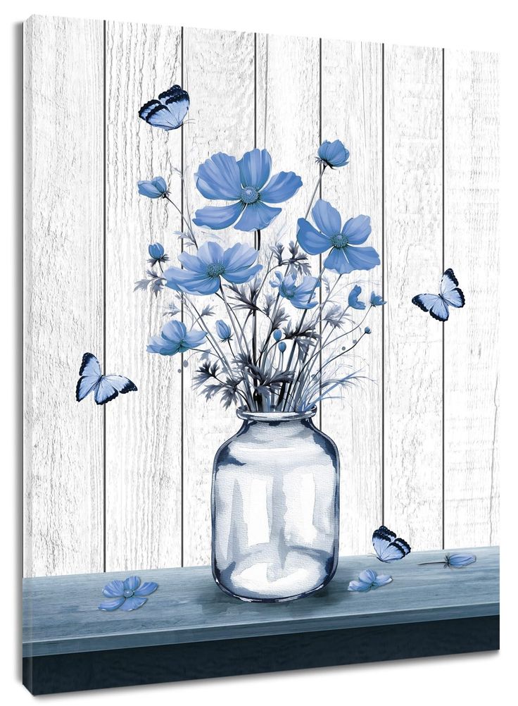 blue flowers and butterflies in a glass vase on a wooden table with white planks